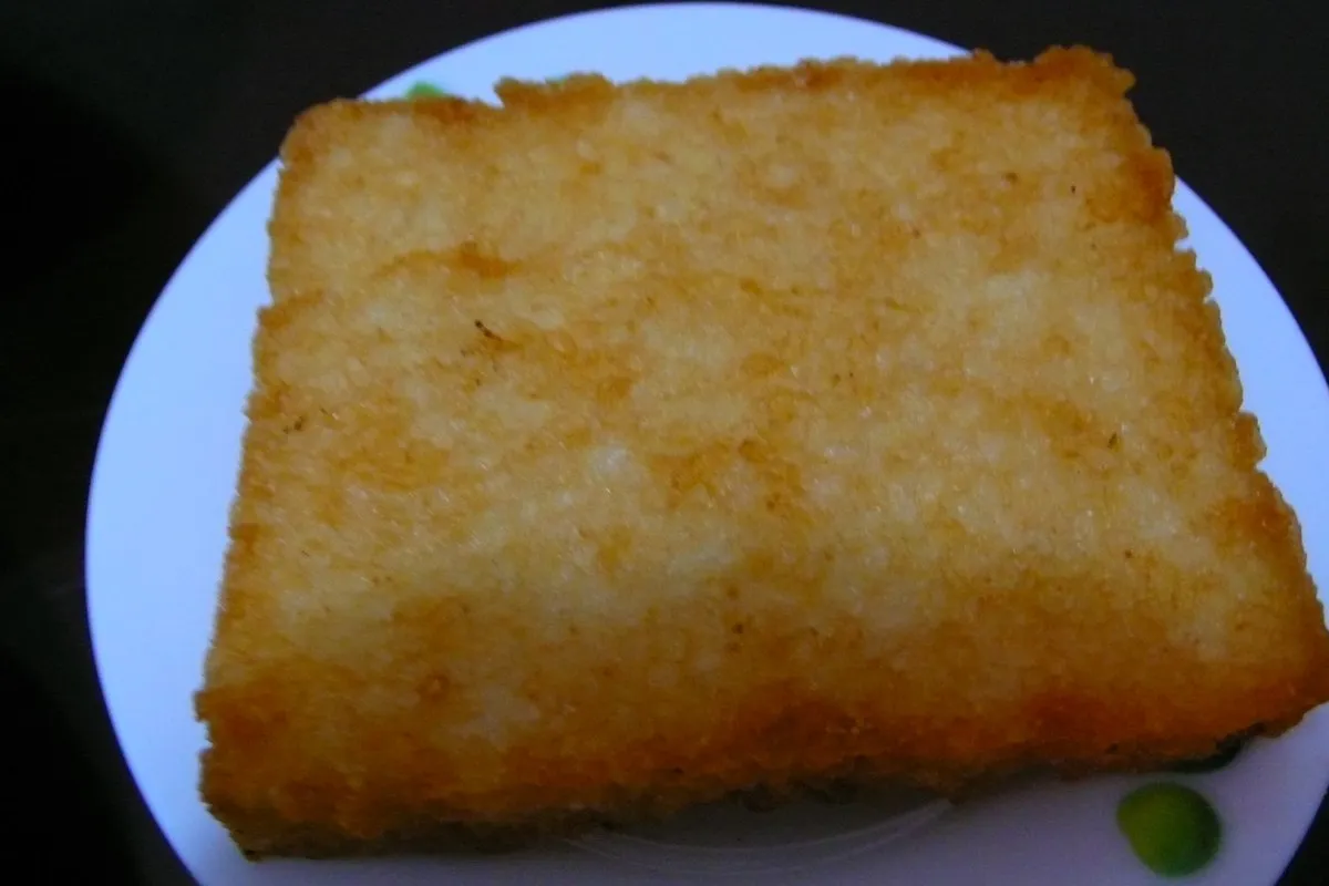 Fried rice cake: rectangular blocks of seasoned rice with a deep-fried golden crust